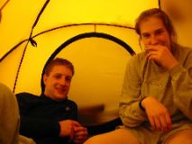 Four of us crammed in a tent as it hails and rains: Paul and Heather (Jess and Vanessa)